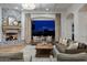 Living room with stone fireplace and backyard view at 1233 E Salado Cir, Mesa, AZ 85203