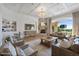 Living room with stone fireplace and backyard view at 1233 E Salado Cir, Mesa, AZ 85203