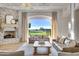 Living room with stone fireplace and access to backyard at 1233 E Salado Cir, Mesa, AZ 85203