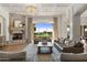 Living room with stone fireplace and access to backyard at 1233 E Salado Cir, Mesa, AZ 85203
