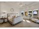 Bright main bedroom with a luxurious bed and pool view at 1233 E Salado Cir, Mesa, AZ 85203
