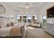 Main bedroom with large windows and a sitting area at 1233 E Salado Cir, Mesa, AZ 85203