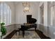 Private music room with grand piano and natural light at 1233 E Salado Cir, Mesa, AZ 85203