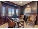 Spacious home office with wood paneling and comfortable seating at 1233 E Salado Cir, Mesa, AZ 85203