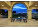 Peaceful patio with arched entryway and outdoor seating at 1233 E Salado Cir, Mesa, AZ 85203