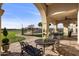 Elegant outdoor dining area with a view of the pool at 1233 E Salado Cir, Mesa, AZ 85203