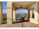 Covered patio with lounge chairs and mountain views at 1233 E Salado Cir, Mesa, AZ 85203