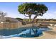 Resort-style pool with fountain and waterslide; expansive backyard view at 1233 E Salado Cir, Mesa, AZ 85203