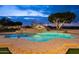 Inviting pool with a spa and a waterslide at 1233 E Salado Cir, Mesa, AZ 85203