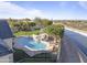 Stunning backyard pool with a slide, spa, turf, and mature landscaping, perfect for relaxing and entertaining guests at 1233 E Salado Cir, Mesa, AZ 85203