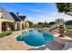 Inviting pool area with a water feature and slide at 1233 E Salado Cir, Mesa, AZ 85203