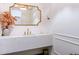 Stylish powder room with a quartz countertop and gold fixtures at 1233 E Salado Cir, Mesa, AZ 85203