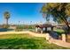 Tennis court with a covered seating area at 1233 E Salado Cir, Mesa, AZ 85203