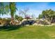 Landscaped area with a large waterfall feature at 1233 E Salado Cir, Mesa, AZ 85203