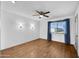 Spacious bedroom with wood floors and window at 13227 N 110Th Ave, Sun City, AZ 85351