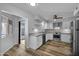 Modern kitchen with stainless steel appliances and granite countertops and access to patio at 13227 N 110Th Ave, Sun City, AZ 85351