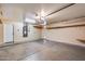 Clean and spacious garage with built-in shelving and ample storage at 13778 W Cambridge Ave, Goodyear, AZ 85395