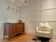 Home bar area with mid-century modern cabinet and patterned wallpaper at 1425 E Desert Cove Ave # 24, Phoenix, AZ 85020