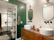 Modern bathroom with double vanity, a large walk-in shower, and a soaking tub at 1425 E Desert Cove Ave # 24, Phoenix, AZ 85020