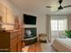 Bright bedroom with fireplace, wood floors, and access to a private balcony at 1425 E Desert Cove Ave # 24, Phoenix, AZ 85020