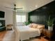 Spacious bedroom with a modern wall accent and a king-size bed at 1425 E Desert Cove Ave # 24, Phoenix, AZ 85020