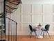 Small dining area with spiral staircase and modern wall paneling at 1425 E Desert Cove Ave # 24, Phoenix, AZ 85020
