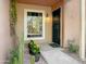Inviting entryway with terracotta colored walls and a security door at 1425 E Desert Cove Ave # 24, Phoenix, AZ 85020