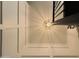 View of a hallway with geometric light fixture and white walls at 1425 E Desert Cove Ave # 24, Phoenix, AZ 85020