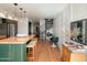 Open concept kitchen with an island and spiral staircase at 1425 E Desert Cove Ave # 24, Phoenix, AZ 85020