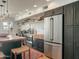 Modern kitchen features stainless steel appliances and dark green cabinetry at 1425 E Desert Cove Ave # 24, Phoenix, AZ 85020