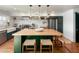 Modern kitchen with butcher block island, stainless steel appliances, and white shaker cabinets at 1425 E Desert Cove Ave # 24, Phoenix, AZ 85020