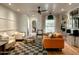 Mid-century modern living room with orange couch and checkerboard rug at 1425 E Desert Cove Ave # 24, Phoenix, AZ 85020