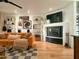 Chic living room featuring an orange couch, fireplace, and built-in shelving at 1425 E Desert Cove Ave # 24, Phoenix, AZ 85020