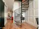 Elegant spiral staircase connecting the floors of the home at 1425 E Desert Cove Ave # 24, Phoenix, AZ 85020