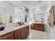 Large bathroom with double vanity, a walk-in shower, and neutral tile flooring at 15041 W Gray Fox Trl, Surprise, AZ 85387