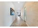 Bright hallway with tile flooring, leading to living areas at 15041 W Gray Fox Trl, Surprise, AZ 85387