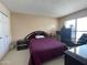 This bedroom features carpet, a window for natural light, a wardrobe, and a comfortable bed at 15240 N 51St St, Scottsdale, AZ 85254