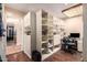 A spacious closet with custom shelving and drawers, adjacent to a modern shower unit at 15240 N 51St St, Scottsdale, AZ 85254