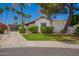 Charming single-story home with well-maintained landscaping, garage, and cozy front entrance at 15240 N 51St St, Scottsdale, AZ 85254