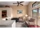 Cozy living area with plush seating, neutral tones, and an adjacent built-in bar at 15240 N 51St St, Scottsdale, AZ 85254