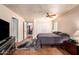 Bedroom with tile floors, access to ensuite bath, and built-in cabinets at 15240 N 51St St, Scottsdale, AZ 85254