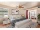 Serene main bedroom with ensuite sitting area, stylish furnishings, neutral color palette, and abundant natural light at 15240 N 51St St, Scottsdale, AZ 85254