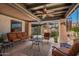 Outdoor patio with lounge furniture, ceiling fan, and view of the backyard at 15240 N 51St St, Scottsdale, AZ 85254