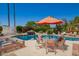 A private pool with a table and umbrella by the pool at 15240 N 51St St, Scottsdale, AZ 85254