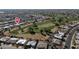 Panoramic aerial view of home next to golf course featuring lush fairways and mature trees in desirable area at 15834 N Nicklaus Ln, Sun City, AZ 85351