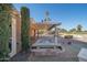 Relaxing covered patio with a spa offering scenic views of the golf course at 15834 N Nicklaus Ln, Sun City, AZ 85351