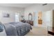 Main bedroom with ensuite bathroom access and dresser at 1626 N 74Th Pl, Mesa, AZ 85207