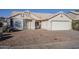 House exterior, two-car garage, and rock landscaping at 1626 N 74Th Pl, Mesa, AZ 85207