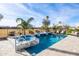 Relaxing pool and spa with a tranquil waterfall feature at 16713 W Monterey Way, Goodyear, AZ 85395