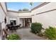 Inviting courtyard entry with brick pavers and seating area at 16832 N Pine Valley Dr, Sun City, AZ 85351